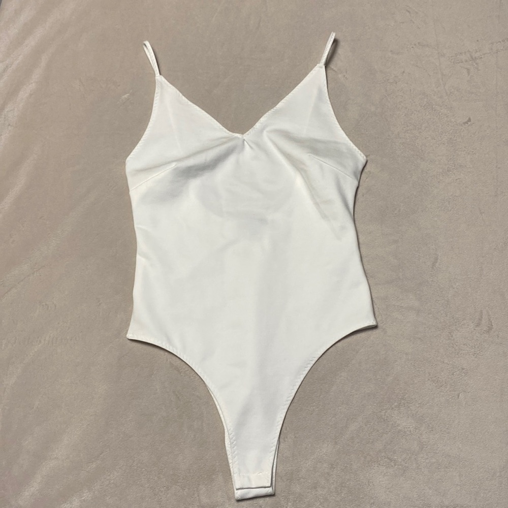 Shinestar bodysuit. New without tags.